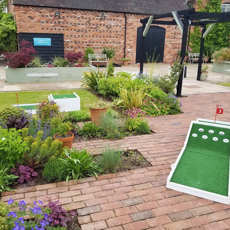 all set up in the gardens at curradine barns. Hire Crazy golf at Curradine Barns.